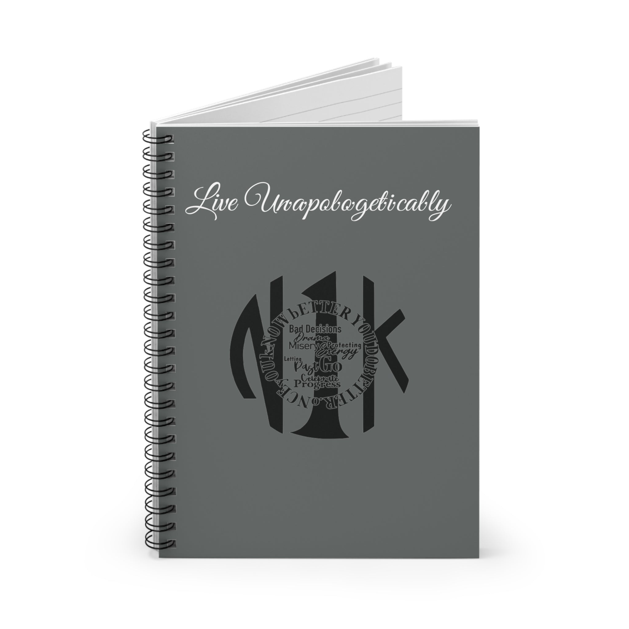 Live Un·a·pol·o·get·i·cal·ly Spiral Notebook with 118 ruled pages and dark grey back cover, 20.3cm by 15.2cm.