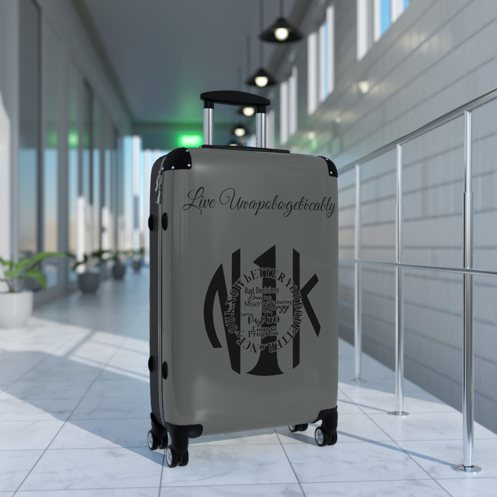 Live Unapologetically Suitcase with adjustable handle, 360° swivel wheels, safety lock, and durable polycarbonate shell in small, medium, and large sizes