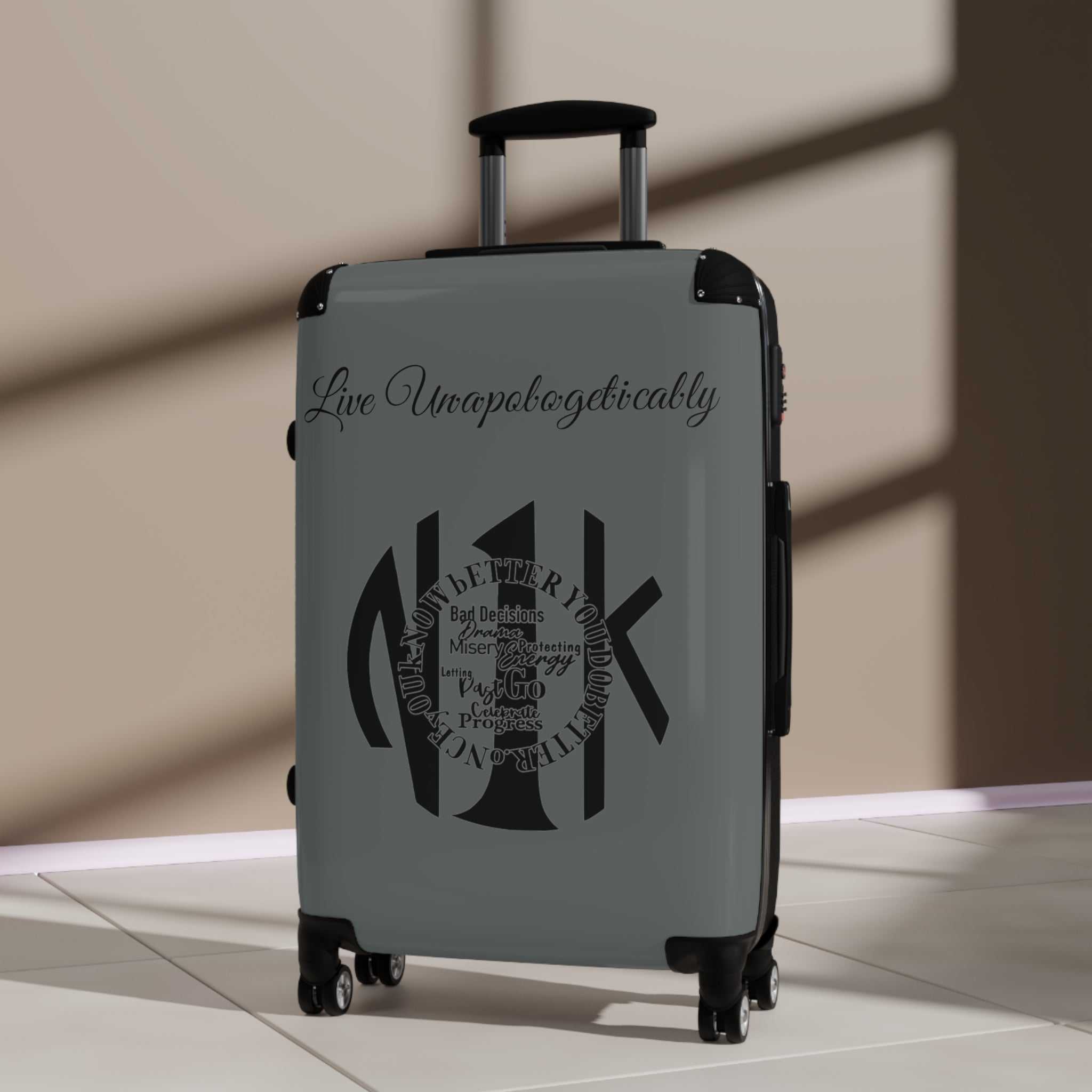 Live Unapologetically Suitcase with polycarbonate shell, adjustable handle, 360° swivel wheels, and built-in lock in small, medium, and large sizes.