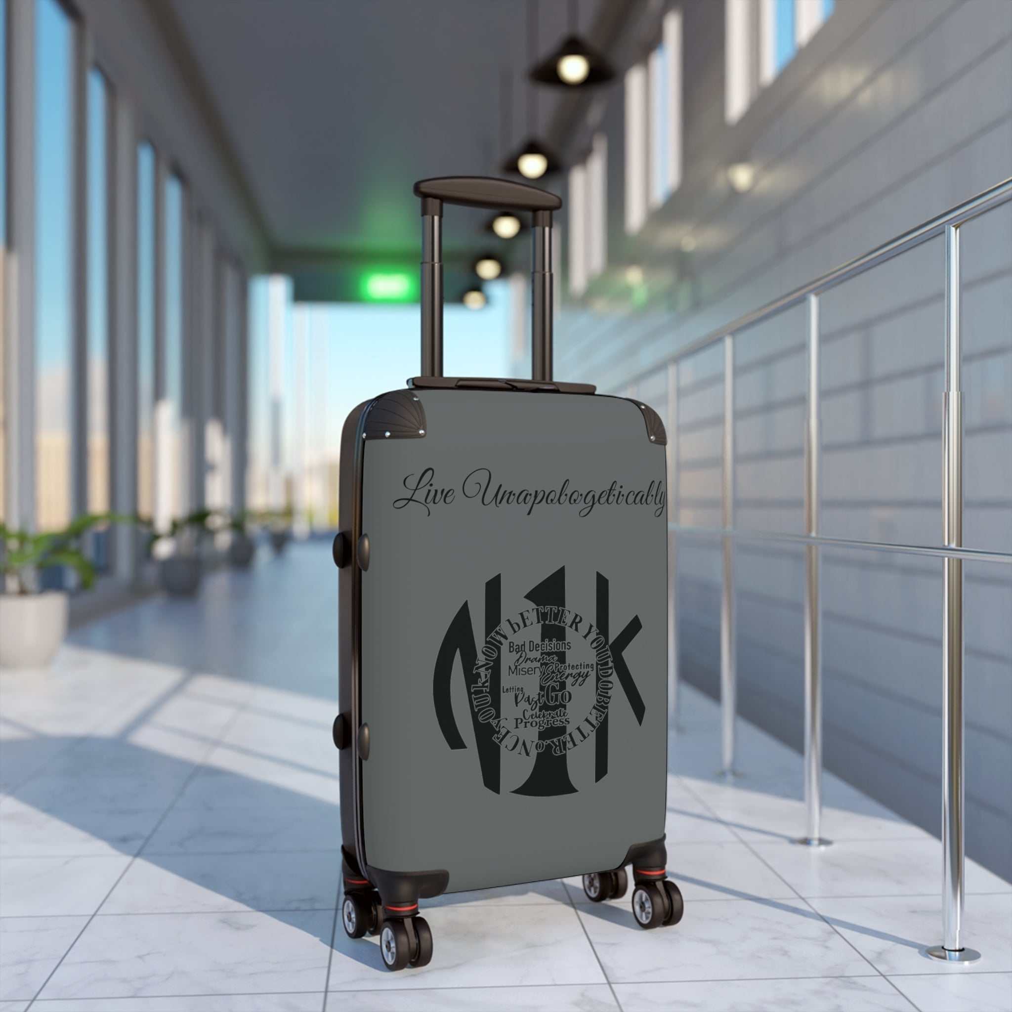 Live Unapologetically Suitcase with adjustable handle, 360° swivel wheels, built-in lock, and hard-shell design in multiple sizes