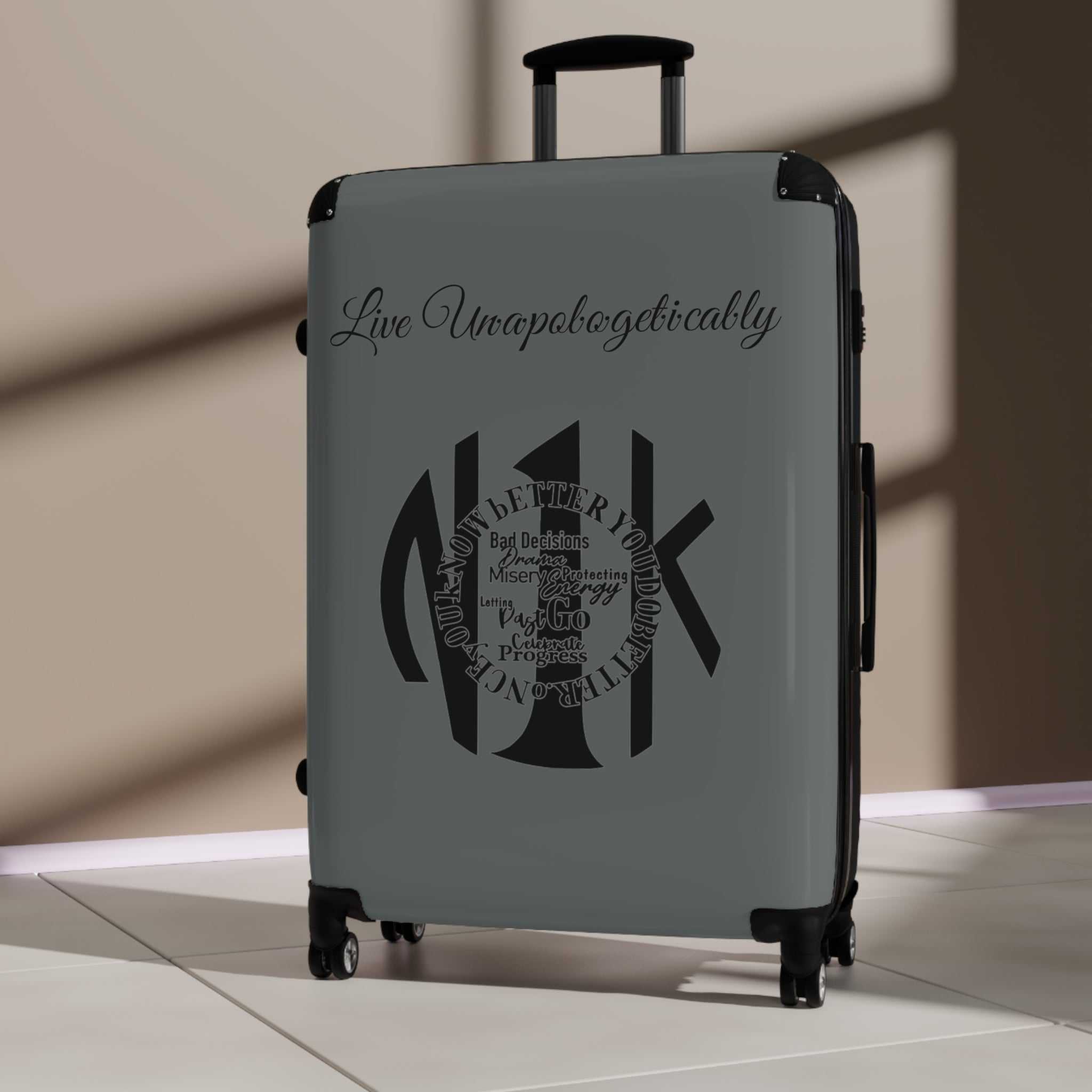 Live Unapologetically Suitcase in polycarbonate hard-shell with adjustable handle and 360-degree swivel wheels, available in small, medium, and large sizes